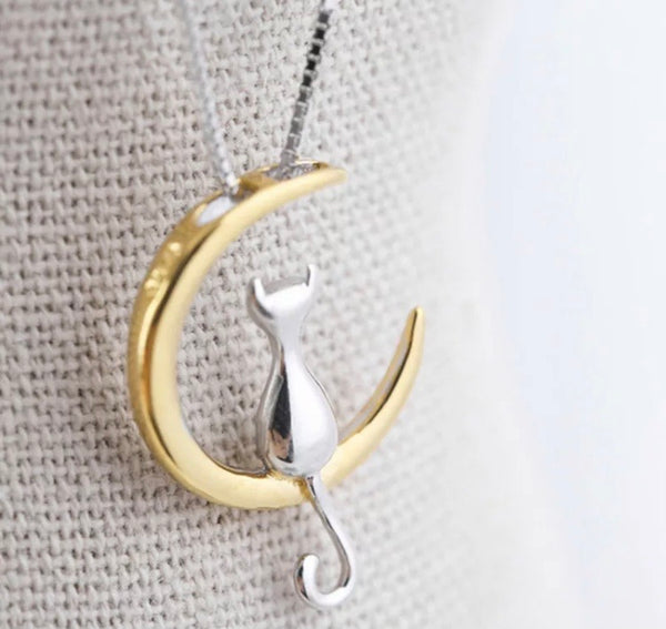 Silver Cat Sitting On A Crescent Moon Necklace